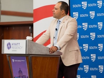 Presenter speaking at podium during SLC 2026,