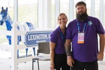 SLC 2026 Volunteers at event display.