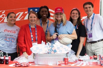 Coca Cola 250 conference sponsor booth at SLC 2025.