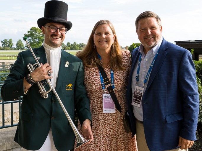 Conference attendees with Keeneland bugler.