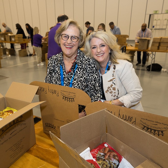 Volunteers packing meals during hunger campaign SLC 2026.