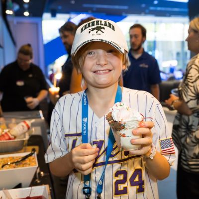 Happy kid at SLC 2026 with a cup of icecream.