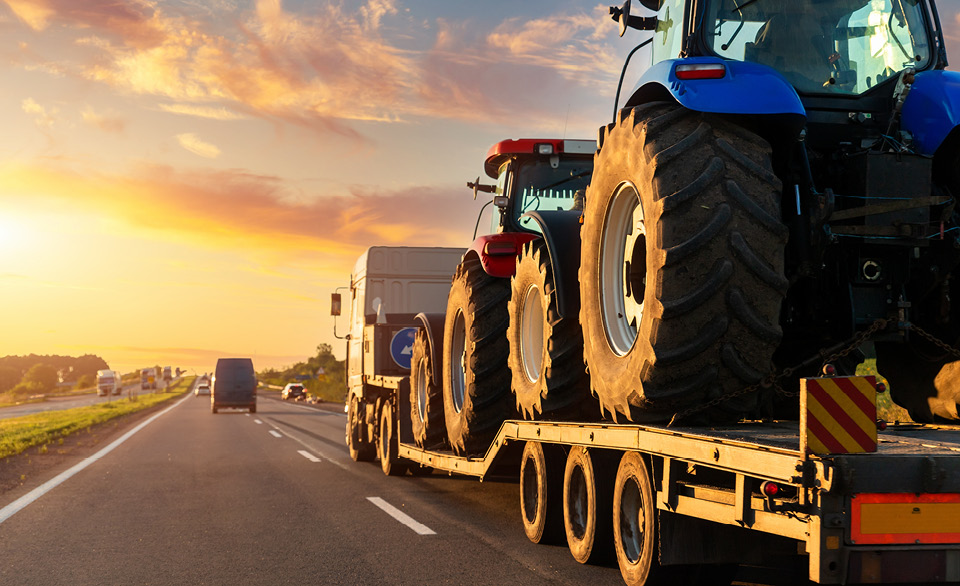 Large truck with multiple cars on board.