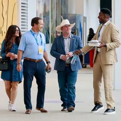 SLC 2026 Attendees walking together in the hall.